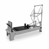 Bodylumina Platinum crni pilates tower reformer s bež kliznom platformom, metalnim tornjem, oprugama, podesivim trakama i footbar osloncem, profesionalna pilates sprava za tower reformer trening, jačanje core mišića, istezanje, stabilnost, rehabilitaciju i oblikovanje tijela kod kuće ili u studiju.